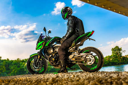 Motocross racers on landscapeの写真素材