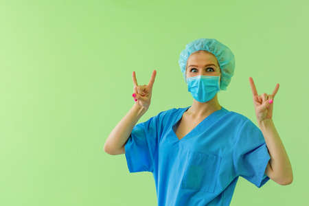 Doctor woman or young intern showing thumbs up.の写真素材