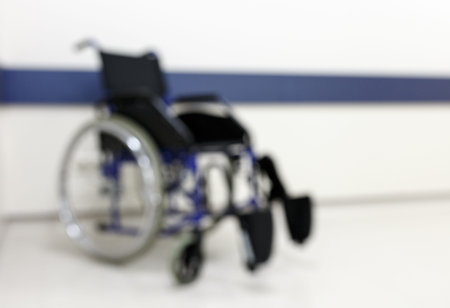 Wheelchair in the empty corridor of the clinicの写真素材