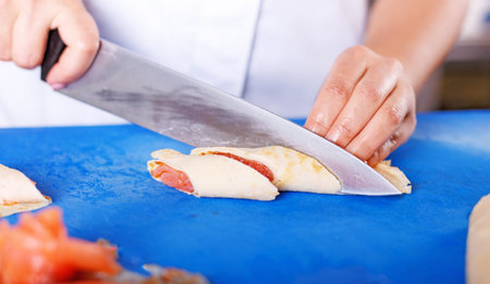 Pancakes with salmon and caviar. hef prepares pancakes with salmon and caviarの写真素材