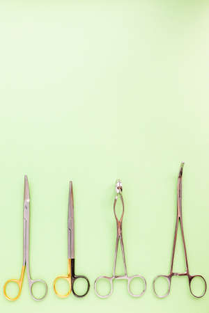 Medical equipments including surgical instruments on green background, top viewの写真素材
