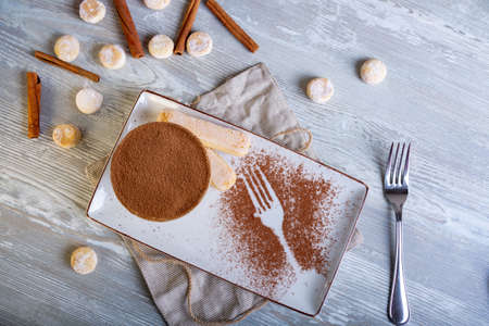 Close up view of beautiful elegant sweet dessert served on the plate. Beautiful decoration, restaurant dish, ready to eat. Tea time, cozy atmosphere.の写真素材