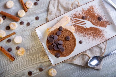 Close up view of beautiful elegant sweet dessert served on the plate. Beautiful decoration, restaurant dish, ready to eat. Tea time, cozy atmosphere.の写真素材