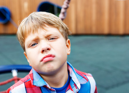 Closeup portrait of a baby boy making a funny face