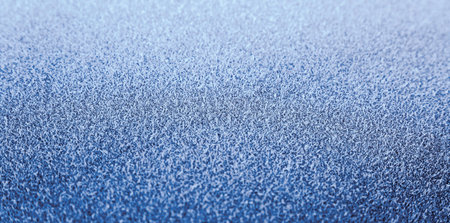 Frozen surface of car in the morning, blue color, close up, texture