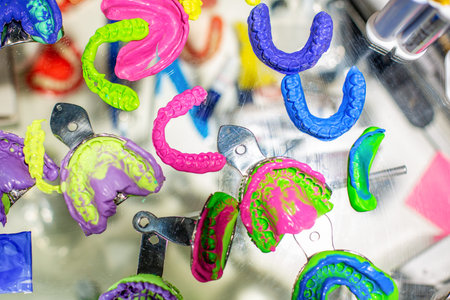 Dental orthodontic tools. Multi-colored device for making a molded tooth. Molding teeth.