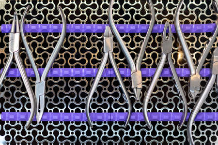 Dental tools and equipment. Over metal grill backgroundの写真素材