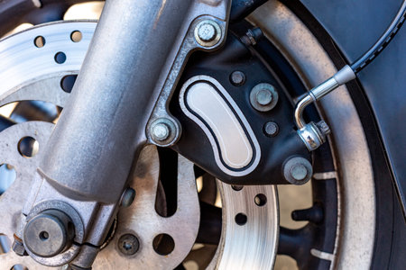Close up of Vintage motorcycle parking on the road. Croped view, wheel