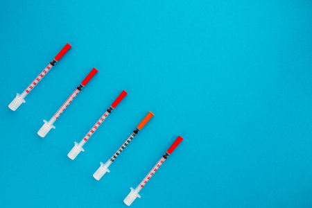 Flat lay of medical instruments on blue background. Mock up health care medical background.の写真素材