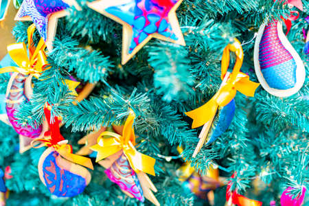 Closeup on Christmas tree decoration over festive backgroundの写真素材