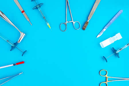 Flat lay of medical instruments on blue background. Mock up health care medical background.の写真素材