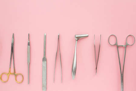 Flat lay of medical instruments on rose background. Mock up health care medical background.の写真素材