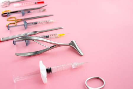 Flat lay of medical instruments on rose background. Mock up health care medical background.の写真素材