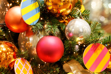 Christmas tree with colorful balls. Concept New Year celebration background. Closeup photo of...