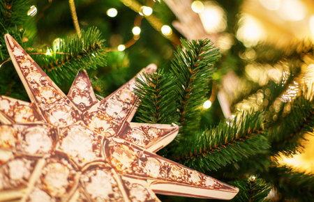 Christmas tree with golden toys. Concept New Year celebration background. Closeup photo of christmas...