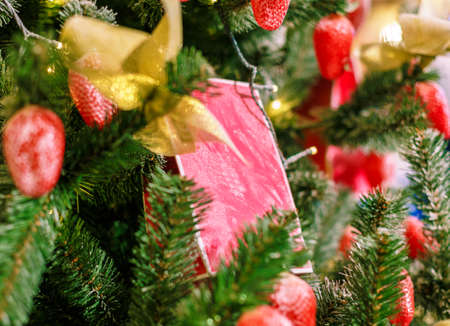 Christmas tree with Christmas toys. Concept New Year celebration background. Closeup photo of christmas tree decorated with Christmas toysの写真素材