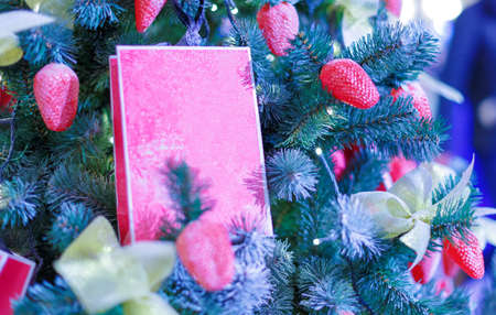 Christmas tree with Christmas toys. Concept New Year celebration background. Closeup photo of christmas tree decorated with Christmas toysの写真素材