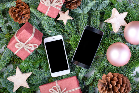 Christmas composition. Christmas decorations, fir tree branches with toys gift boxes and smart...