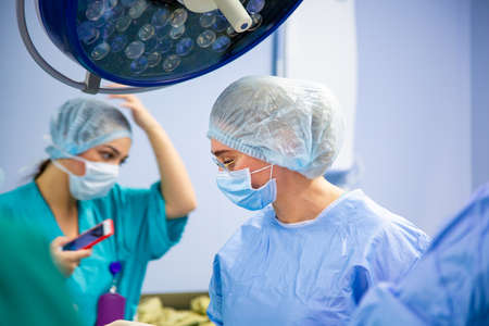Surgeons team working in the hospital, operating roomの写真素材