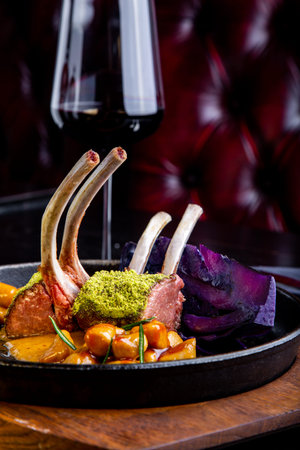delicious restaurant dish, rack of lamb in restaurant background. Healthy exclusive food on big...