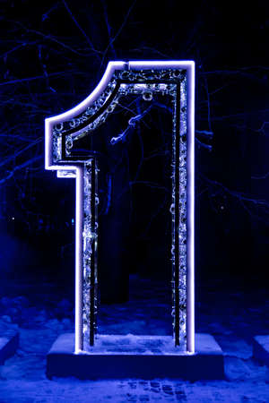 Part of New Year sign 2019, number 1, framed with decorated street lamps, street garlands.の写真素材