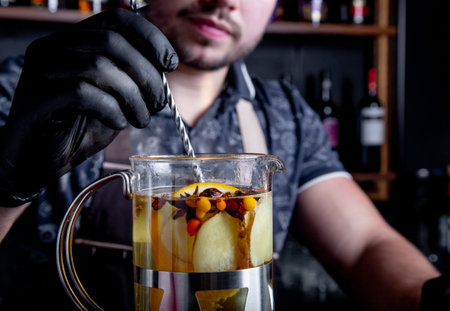 Process brewing tea,tea ceremony. Bartender preparing sea buckthorn tea