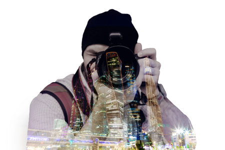 Double exposure, a man taking photography and modern big city at night background