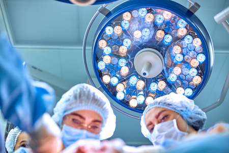 Surgeons team working in the hospital, operating roomの写真素材