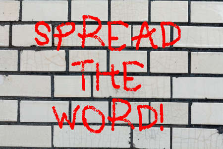 Conceptual hand writing showing Spread The Word. Business photo text Communicate the news to everybody Make something popular Brick Wall art like Graffiti motivational call written on the wallの写真素材
