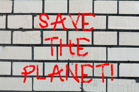 Conceptual hand writing showing Save The Planet. Business photo text Take care of the environment do ecological actions Brick Wall art like Graffiti motivational call written on the wallの写真素材