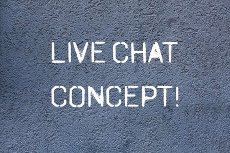 Text sign showing Live Chat Concept. Conceptual photo web service that allows showing friends to communicate Brick Wall art like Graffiti motivational call written on the wallの写真素材