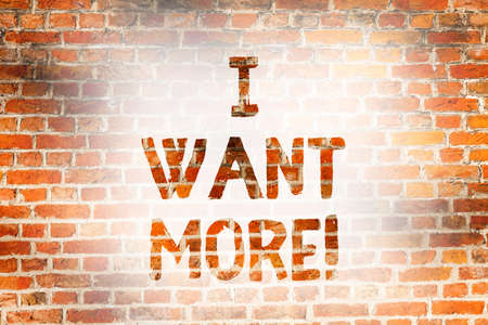 Writing note showing I Want More. Business photo showcasing Not having enough of something bigger challenges requirements Brick Wall art like Graffiti motivational call written on the wallの写真素材