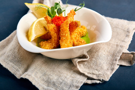 fried shrimps in batter with spinach sauce