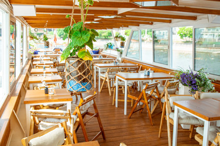The interior of the urban river ship, with a panoramic view of the urban landscape. The concept of...