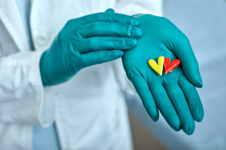 doctor holding simbols of heart in hand with medical care concept, Medicine in hospital, cardiology