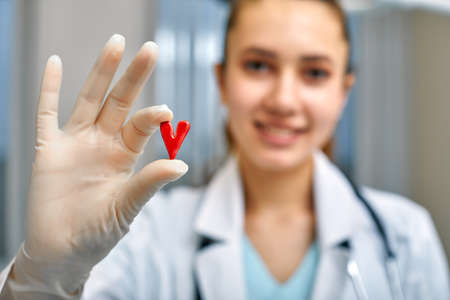 doctor holding simbols of heart in hand with medical care concept, Medicine in hospital, cardiologyの写真素材