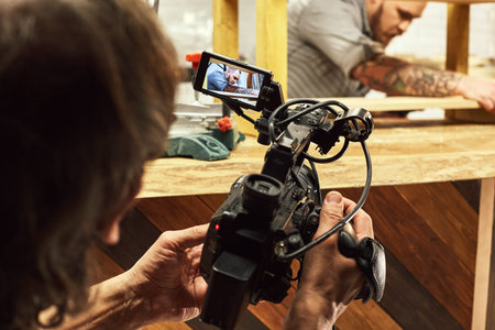 Video production backstage. Behind the scenes of creating video content, a professional team of...