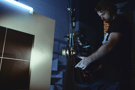 Video production backstage. Behind the scenes of creating video content, a professional team of...