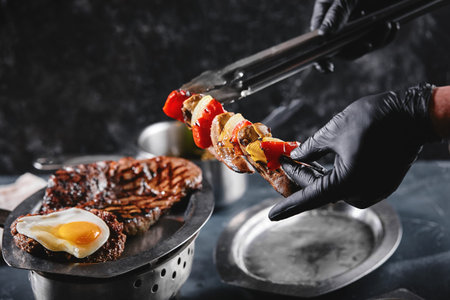Grilled meat platter. Assorted delicious grilled meat with vegetables. Grilled mixed meat with...