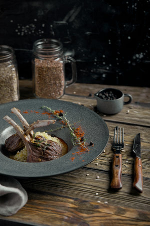 Rack of lamb with polenta. Low key, copyspace, rustic style