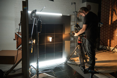 Behind the scenes of filming movies and video products, setting up equipment for shooting video and...