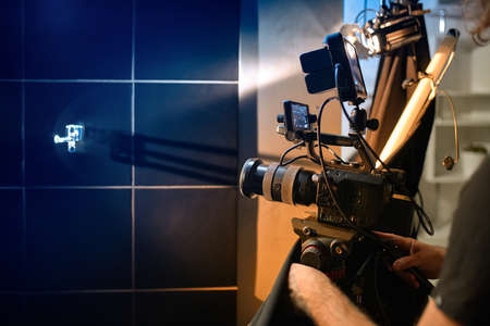Behind the scenes of filming movies and video products, setting up equipment for shooting video and sound. The concept of producing video content for social networks, TV and blogsの写真素材