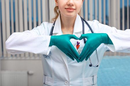 The doctor hands shows the heart, a symbol of health. Copy space, modern medicine, hypocrate oathの写真素材