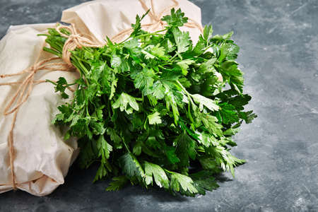 Parsley on a gray background, eco-friendly parking, food delivery, copy space Fresh green parsleyの写真素材