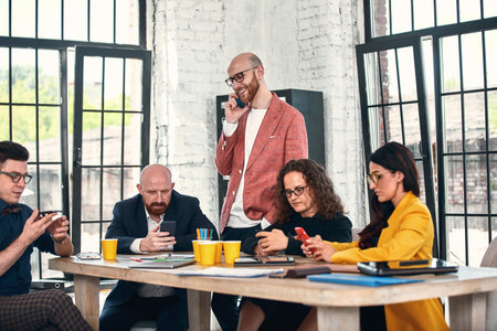 Business meeting in an office, the businesspeople are discussing a document