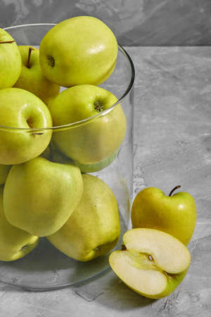yellow apples on the table. Top view with copy space on gray stone background.の写真素材
