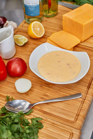 Many different spices, vegetables and ingredients, and fresh herbs for making homemade sauceの写真素材