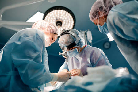 A team of surgeons is fighting for life, for a real operation, for real emotions. The intensive care team is fighting for the life of the patient. Saving life, the struggle for lifeの写真素材