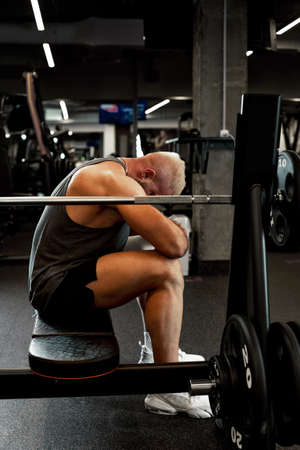 Male athlete resting after a heavy workout.の写真素材