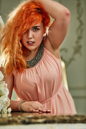 Plus size fashion model, fat woman on luxury interior, overweight female body, professional make-up and hairstyleの写真素材